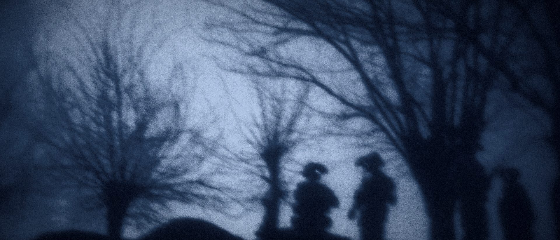 Silhouetted personnel during a night operation